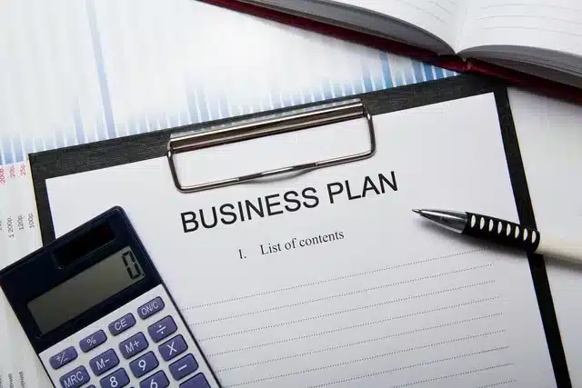 California small business formation plan and document filing timeline laid out on a desk