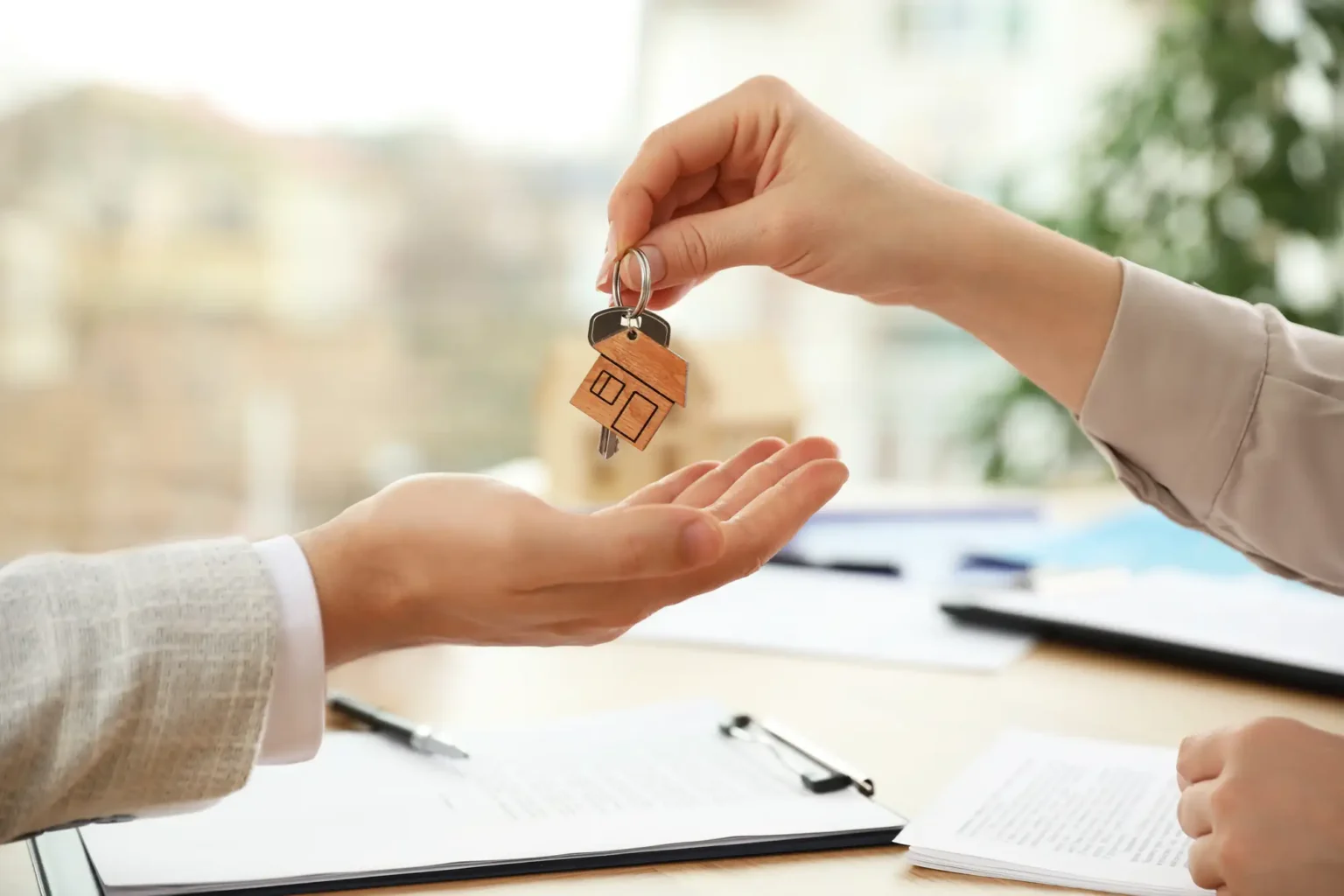 House keys being handed over for a California home owned by someone who now lives out of state