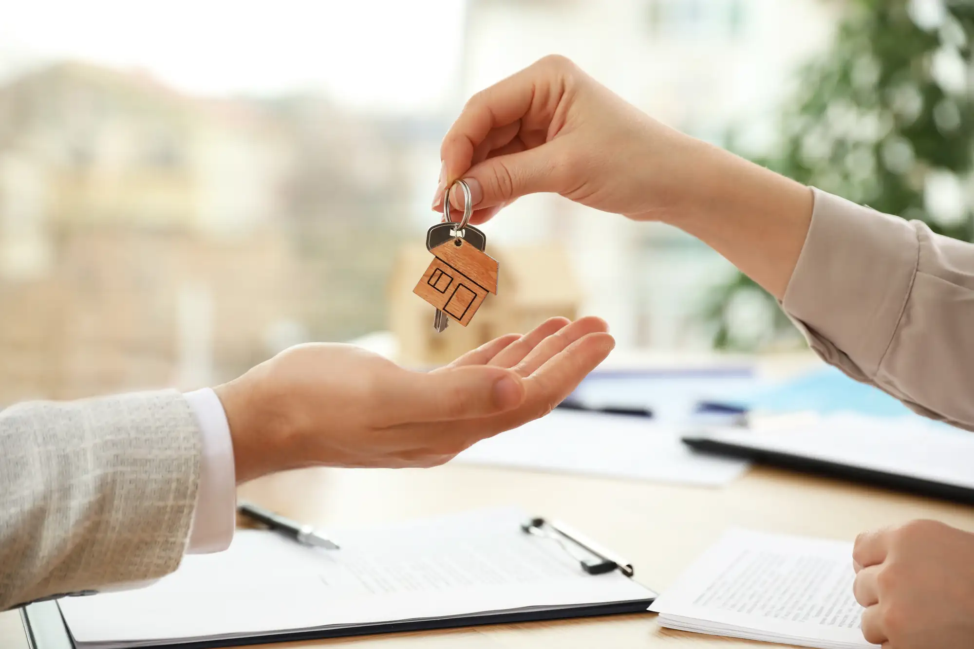 Handing over keys after a completed California mobile home title transfer with HCD